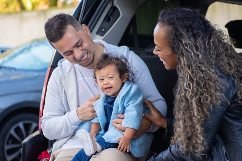 Family sitting in trunk of newly insured automobile in Columbus