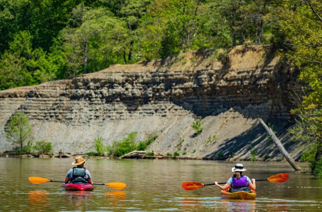 A young couple kayaks on The Scioto River in Columbus, Ohio